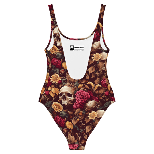 back view of one-piece swimsuit that blends hauntingly beautiful skulls with lush, full-bodied roses and golden sunflowers against a rich burgundy backdrop. Each intricate detail captures the delicate balance between mortality and bloom