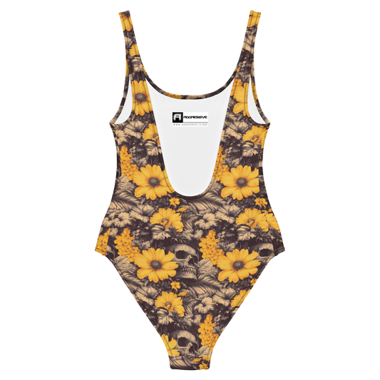 back view of one-piece swimsuit Deadly Petals which features a surreal collision of vivid golden blooms and shadowy skulls hidden in a jungle of inked leaves
